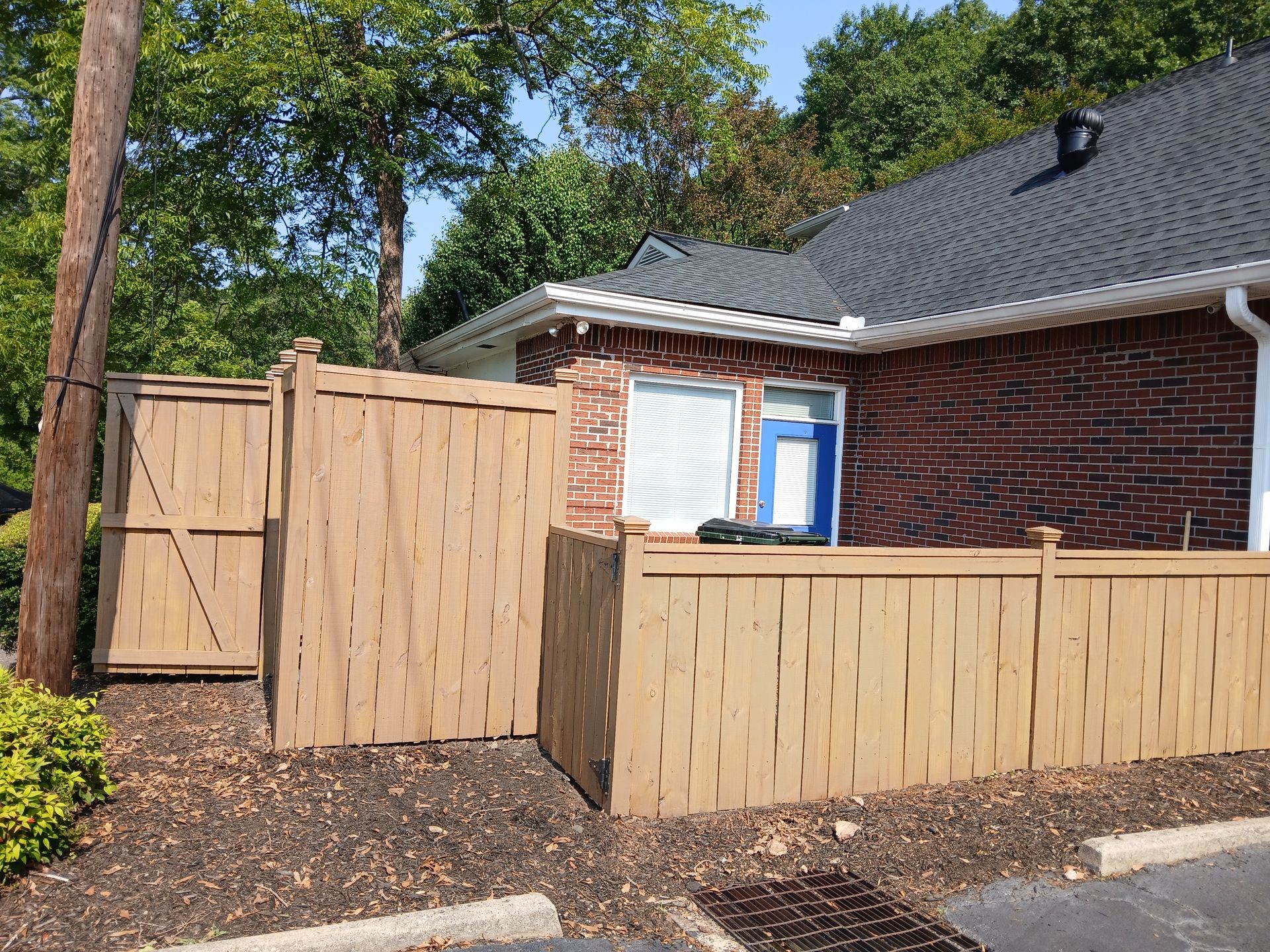Custom fence with semi transparent stain SW Banyon brown